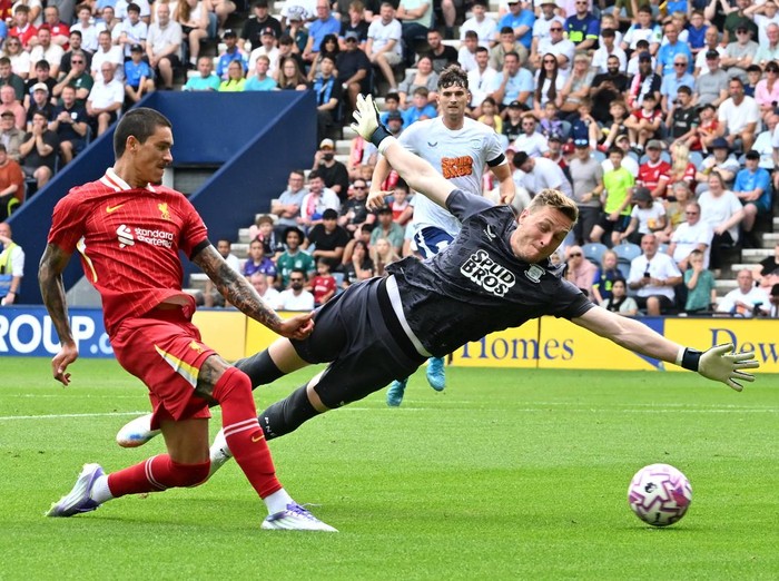 PRESTON, ENGLAND - JULY 13: (THE SUN OUT, THE SUN ON SUNDAY OUT) Darwin Nunez of Liverpool scores his team's second goal past Daniel Iversen of Preston North End during the pre-season friendly match between Preston North End and Liverpool at Deepdale on July 13, 2025 in Preston, England. (Photo by Liverpool FC/Liverpool FC via Getty Images)