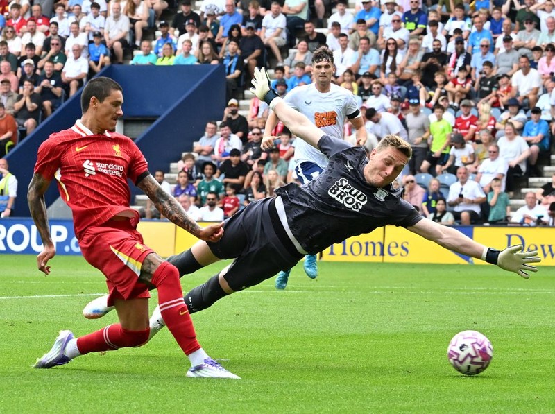 PRESTON, ENGLAND - JULY 13: (THE SUN OUT, THE SUN ON SUNDAY OUT) Darwin Nunez of Liverpool scores his team's second goal past Daniel Iversen of Preston North End during the pre-season friendly match between Preston North End and Liverpool at Deepdale on July 13, 2025 in Preston, England. (Photo by Liverpool FC/Liverpool FC via Getty Images)