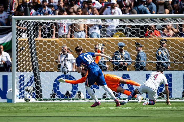 EAST RUTHERFORD, NEW JERSEY - JULY 13: Cole Palmer of Chelsea scores his teams second goal against Lucas Berlado  of PSG during the FIFA Club World Cup 2025 final match between Chelsea FC and Paris Saint-Germain at MetLife Stadium on July 13, 2025 i
