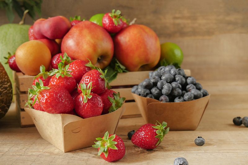 Fresh fruits. Healthy food. Mixed fruit, apricots and peaches. Blueberry. various fruits on an old wooden table. Organic healthy assorted fruits. place for text