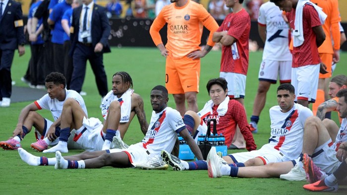 Soccer Football - FIFA Club World Cup - Final - Chelsea v Paris St Germain - MetLife Stadium, East Rutherford, New Jersey, U.S. - July 13, 2025 Paris St Germains Ousmane Dembele, Senny Mayulu, Bradley Barcola, Lee Kang-in and Achraf Hakimi look dejected after the match IMAGN IMAGES via Reuters/Mark Smith     TPX IMAGES OF THE DAY