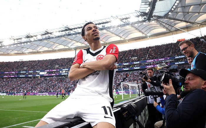 FRANKFURT AM MAIN, GERMANY - APRIL 13: Hugo Ekitike of Eintracht Frankfurt celebrates scoring his team's third goal during the Bundesliga match between Eintracht Frankfurt and 1. FC Heidenheim 1846 at Deutsche Bank Park on April 13, 2025 in Frankfurt am Main, Germany. (Photo by Alex Grimm/Getty Images)