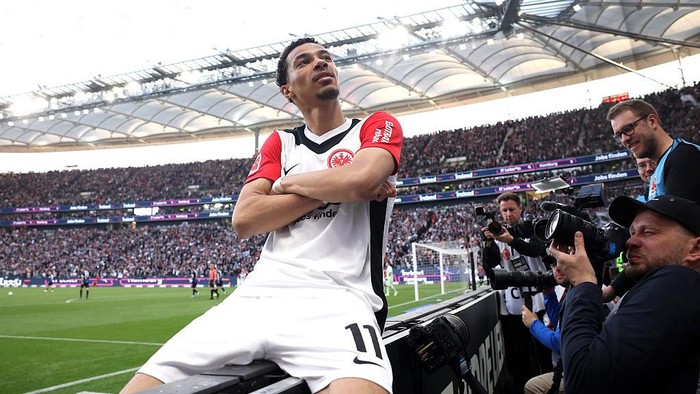 FRANKFURT AM MAIN, GERMANY - APRIL 13: Hugo Ekitike of Eintracht Frankfurt celebrates scoring his teams third goal during the Bundesliga match between Eintracht Frankfurt and 1. FC Heidenheim 1846 at Deutsche Bank Park on April 13, 2025 in Frankfurt am Main, Germany. (Photo by Alex Grimm/Getty Images)