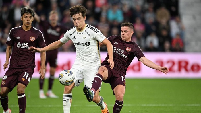 EDINBURGH, SCOTLAND - AUGUST 17: Hearts Cammy Devlin and Rosenborgs Sverre Halseth Nypan during a UEFA Conference League Qualifier between Heart of Midlothian and Rosenborg at Tynecastle Park, on August 17, 2023, in Edinburgh, Scotland. (Photo by Paul Devlin/SNS Group via Getty Images)