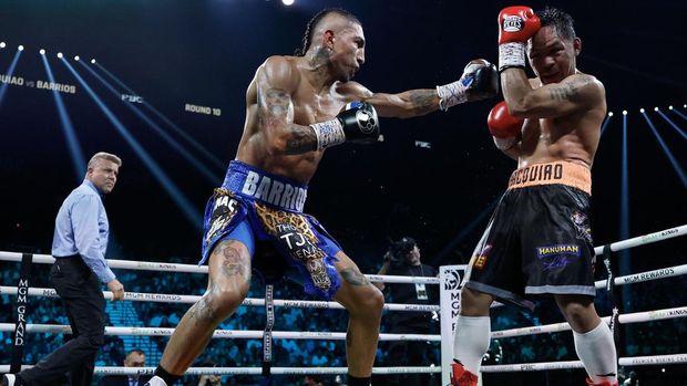 LAS VEGAS, NEVADA - JULY 19: Mario Barrios punches Manny Pacquiao during their WBC welterweight title fight ending in a majority draw at MGM Grand Garden Arena on July 19, 2025 in Las Vegas, Nevada.   Harry How/Getty Images/AFP (Photo by Harry How / GETTY IMAGES NORTH AMERICA / Getty Images via AFP)
