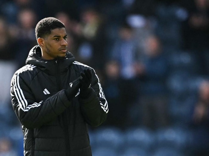 Aston Villa's English striker #09 Marcus Rashford applauds as he celebrates at the end of the English FA Cup quarter-final football match between Preston North End and Aston Villa at Deepdale stadium in Preston, north-west England on March 30, 2025. Aston Villa wins 3 - 0 against Preston North End. (Photo by Paul ELLIS / AFP) / RESTRICTED TO EDITORIAL USE. No use with unauthorized audio, video, data, fixture lists, club/league logos or 'live' services. Online in-match use limited to 120 images. An additional 40 images may be used in extra time. No video emulation. Social media in-match use limited to 120 images. An additional 40 images may be used in extra time. No use in betting publications, games or single club/league/player publications. /
