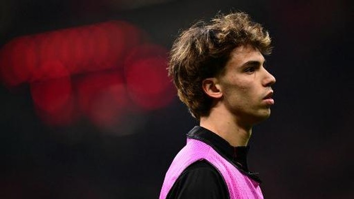 Joao Felix AC Milans Portughese forward #79 Joao Flix warms up before the UEFA Champions League knockout round play-off second leg football match between AC Milan and Feyenoord at San Siro stadium in Milan, on February 18, 2025. (Photo by Marco BERTORELLO / AFP)