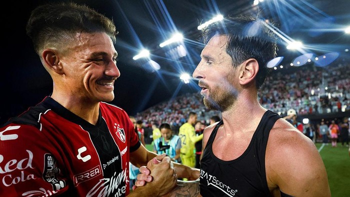 FORT LAUDERDALE, FLORIDA - JULY 30: Lionel Messi #10 of Inter Miami greets Matías Cóccaro #7 of Atlas following Inter Miamis win of Leagues Cup Phase One match between Inter Miami CF and Atlas FC at Chase Stadium on July 30, 2025 in Fort Lauderdale, Florida. (Photo by Carmen Mandato - Leagues Cup/MLS via Getty Images)