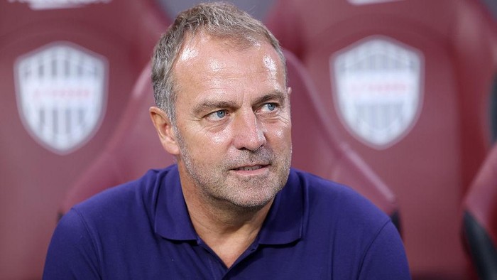 KOBE, JAPAN - JULY 27: FC Barcelonas coach Hansi Flick looks on before the preseason friendly between Vissel Kobe and FC Barcelona at Noevir Stadium Kobe on July 27, 2025 in Kobe, Hyogo, Japan. (Photo by Paul Miller/Getty Images)