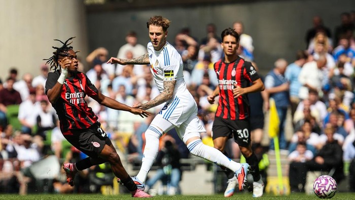 Leeds Uniteds Joe Rodon (centre) with AC Milans Samuel Chukwueze (left) during the pre-season friendly match at Aviva Stadium in Dublin, Ireland. Picture date: Saturday August 9, 2025. (Photo by Evan Treacy/PA Images via Getty Images)