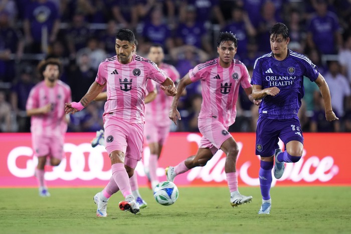 ORLANDO, FLORIDA - AUGUST 10: Luis Suárez #9 of Inter Miami CF shoots whilst under pressure from Rodrigo Schlegel #15 of Orlando City during the MLS match between Orlando City and Inter Miami CF at Inter&Co Stadium on August 10, 2025 in Orlando, Florida. (Photo by Rich Storry/Getty Images)