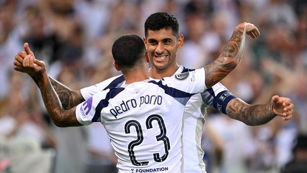 UDINE, ITALY - AUGUST 13: Cristian Romero of Tottenham Hotspur celebrates scoring his team's second goal with teammate Pedro Porro during the UEFA Super Cup 2025 match between Paris Saint-Germain and Tottenham Hotspur at Stadio Friuli on August 13, 2025 in Udine, Italy. (Photo by Tullio Puglia - UEFA/UEFA via Getty Images)