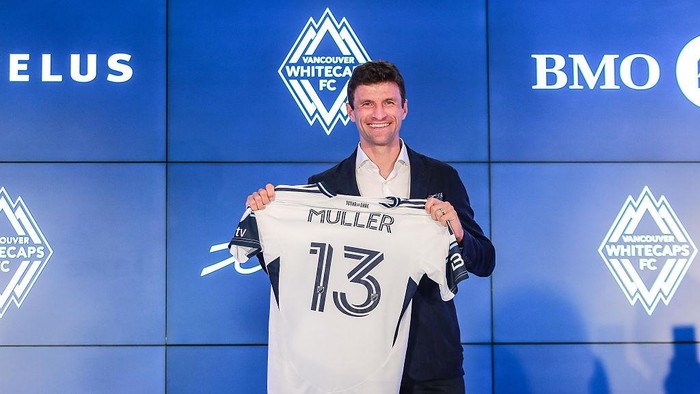 VANCOUVER, BRITISH COLUMBIA - AUGUST 14: German football player Thomas Müller holds his jersey as he was introduced by the Vancouver Whitecaps during a press conference at TELUS Garden on August 14, 2025 in Vancouver, British Columbia.  (Photo by Elizabeth Ruiz Ruiz/Getty Images)