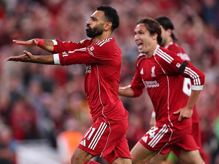 LIVERPOOL, ENGLAND - AUGUST 15: Mohamed Salah of Liverpool celebrates after scoring a goal to make it 4-2 during the Premier League match between Liverpool and Bournemouth at Anfield on August 15, 2025 in Liverpool, England. (Photo by Robbie Jay Barratt - AMA/Getty Images)