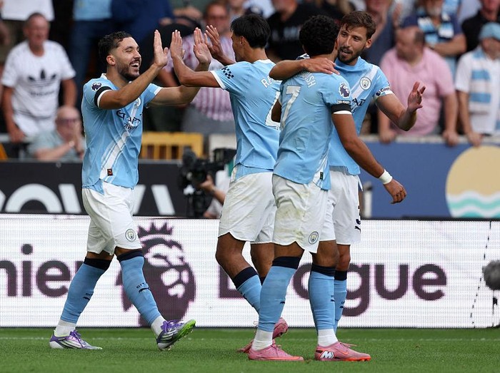 WOLVERHAMPTON, ENGLAND - AUGUST 16: Rayan Cherki, Tijjani Reijnders, OMar Marmoush and Ruben Dias of Manchester City celebrate 4th goal during the Premier League match between Wolverhampton Wanderers and Manchester City at Molineux on August 16, 2025 in Wolverhampton, England. (Photo by Neal Simpson/Sportsphoto/Allstar via Getty Images)