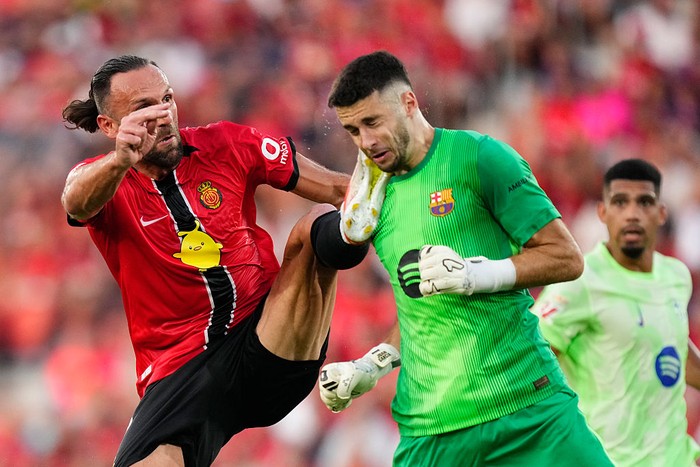 Vedat Muriqi centre-forward of Mallorca and Kosovo and Joan Garcia goalkeeper of Barcelona and Spaincompete for the ball during the LaLiga EA Sports match between RCD Mallorca and FC Barcelona at Estadio de Son Moix on August 17, 2025 in Mallorca, Spain. (Photo by Jose Breton/Pics Action/NurPhoto via Getty Images)