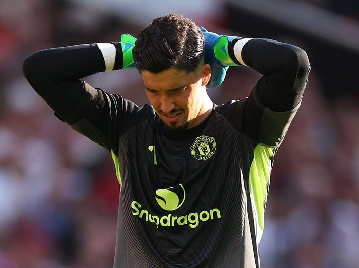 MANCHESTER, ENGLAND - AUGUST 17:  Altay Bayindir of Manchester United looks dejected during the Premier League match between Manchester United and Arsenal at Old Trafford on August 17, 2025 in Manchester, England. (Photo by Marc Atkins/Getty Images)