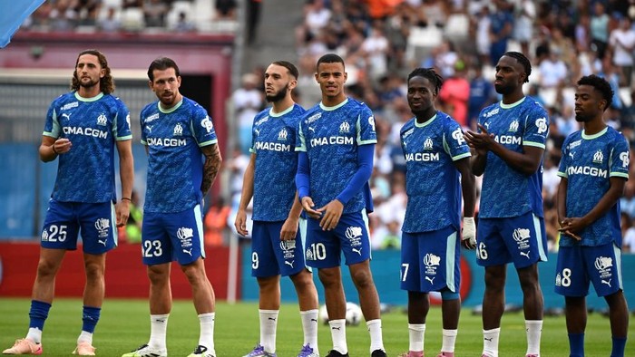 (From l) Marseilles French midfielder #25 Adrien Rabiot, Marseilles Danish midfielder #23 Pierre-Emile Hojbjerg, Marseilles Algerian forward #09 Amine Gouiri, Marseilles English forward #10 Mason Greenwood, Marseilles English forward #17 Jonathan Rowe, Marseilles Swiss defender #06 Ulisses Garcia and Marseilles British midfielder #08 Angel Gomes stand on the pitcj prior to the friendly football match between Olympique de Marseille (OM) and Aston Villa at the Velodrome stadium in Marseille, southern France on August 9, 2025. (Photo by Miguel MEDINA / AFP)