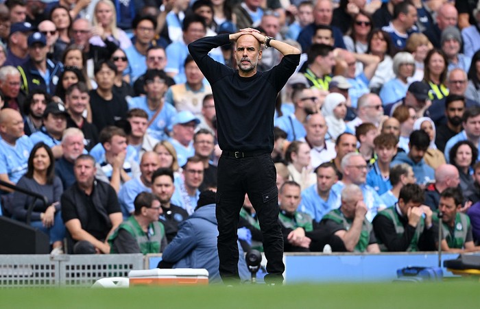 MANCHESTER, ENGLAND - AUGUST 23: Pep Guardiola, Manager of Manchester City reacts during the Premier League match between Manchester City and Tottenham Hotspur at Etihad Stadium on August 23, 2025 in Manchester, England. (Photo by Shaun Botterill/Getty Images)