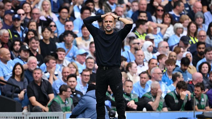 MANCHESTER, ENGLAND - AUGUST 23: Pep Guardiola, Manager of Manchester City reacts during the Premier League match between Manchester City and Tottenham Hotspur at Etihad Stadium on August 23, 2025 in Manchester, England. (Photo by Shaun Botterill/Getty Images)