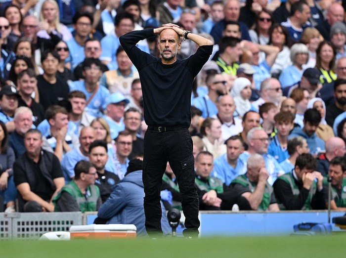 MANCHESTER, ENGLAND - AUGUST 23: Pep Guardiola, Manager of Manchester City reacts during the Premier League match between Manchester City and Tottenham Hotspur at Etihad Stadium on August 23, 2025 in Manchester, England. (Photo by Shaun Botterill/Getty Images)