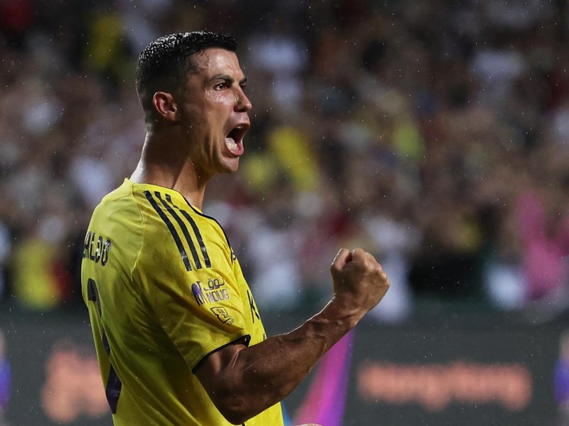 Soccer Football - Saudi Super Cup - Final - Al Nassr v Al Ahli - Hong Kong Stadium, Hong Kong, China - August 23, 2025  Al Nassr's Cristiano Ronaldo celebrates after scoring during the penalty shootout REUTERS/Tyrone Siu