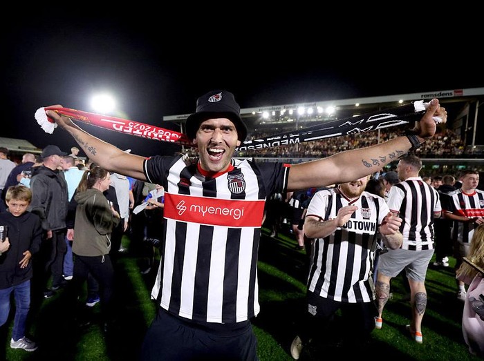 Grimsby Town fans celebrate their victory in the shoot out against Manchester United during the Carabao Cup second round match at Hill Blundell Park, Grimsby. Picture date: Wednesday August 27, 2025. (Photo by Nigel French/PA Images via Getty Images)