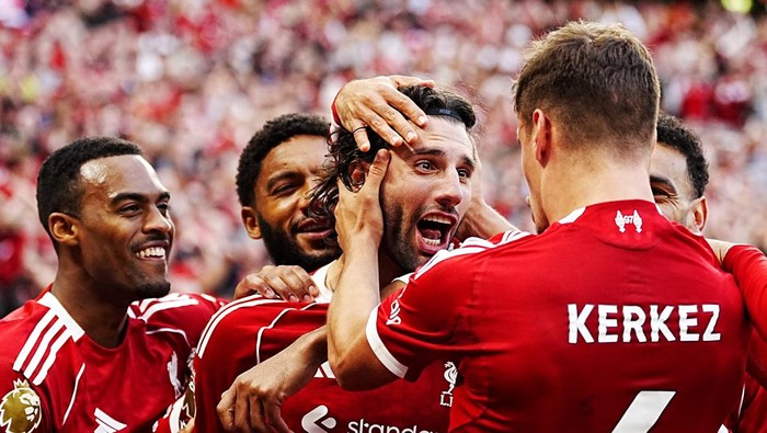 Liverpools Dominik Szoboszlai (centre right) celebrates scoring their sides first goal with team-mates during the Premier League match at Anfield, Liverpool. Picture date: Sunday August 31, 2025. (Photo by Peter Byrne/PA Images via Getty Images)