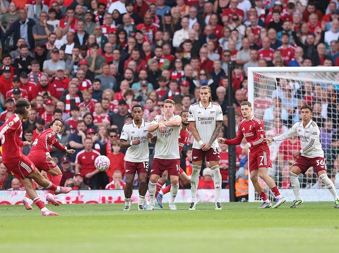 LIVERPOOL, ENGLAND - AUGUST 31: Dominik Szoboszlai of Liverpool scores his team's first goal in a free kick during the Premier League match between Liverpool and Arsenal at Anfield on August 31, 2025 in Liverpool, England. (Photo by Alex Pantling/Getty Images)