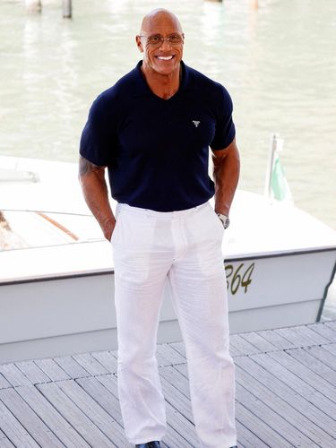 Actor Dwayne Johnson poses for pictures, as he arrives at the 82nd Venice Film Festival, Venice, Italy, September 1, 2025. REUTERS/Remo Casilli