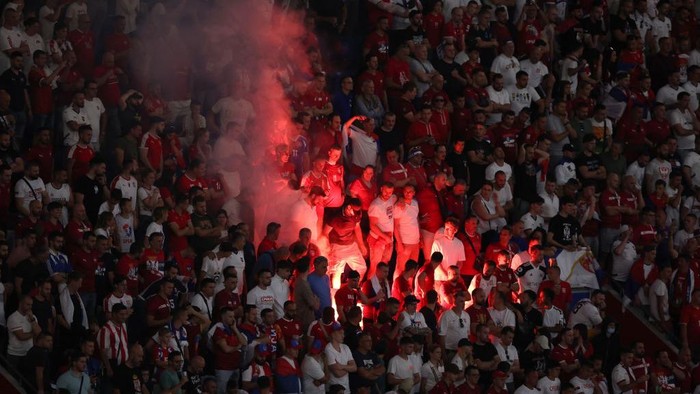 MUNICH, GERMANY - JUNE 25: Serbias supporters light flares during the UEFA EURO 2024 group stage match between Denmark and Serbia at Munich Football Arena on June 25, 2024 in Munich, Germany. (Photo by Stefan Matzke - sampics/Corbis via Getty Images)
