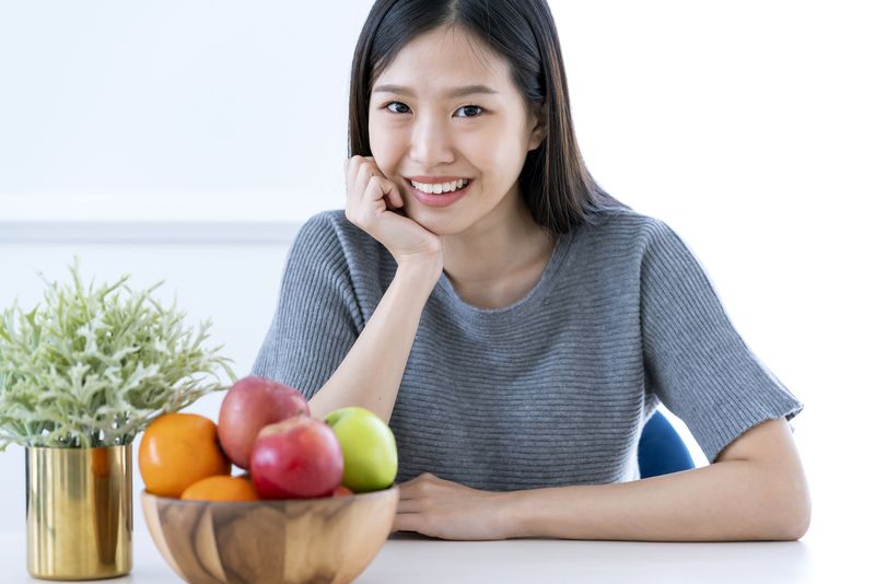 healthy and beautiful asian woman smile happiness with bowl of fresh fruit diet and eat  good nutrition healthy ideas concept