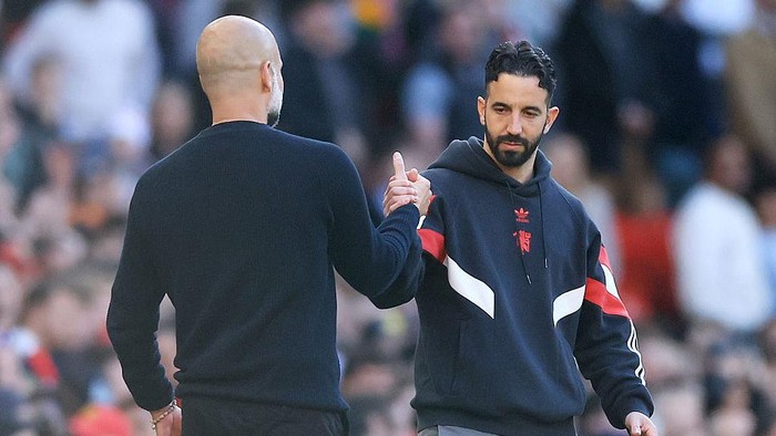 MANCHESTER, ENGLAND - APRIL 06: Ruben Amorim, Manager of Manchester United, embraces with Pep Guardiola, Manager of Manchester City, after the Premier League match between Manchester United FC and Manchester City FC at Old Trafford on April 06, 2025 in Manchester, England. (Photo by Carl Recine/Getty Images)