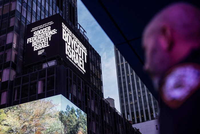 A billboard in Times Square displays the message 