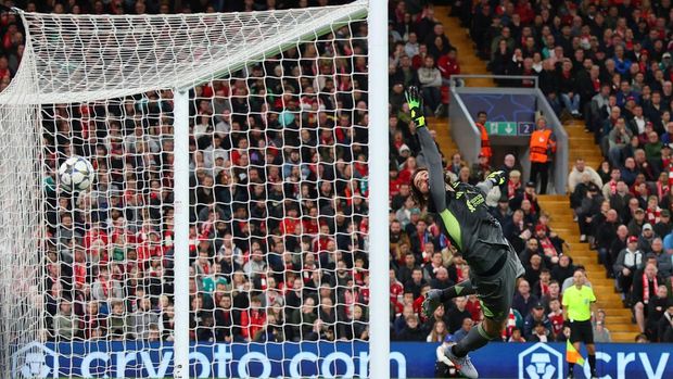 Soccer Football - UEFA Champions League - Liverpool v Atletico Madrid - Anfield, Liverpool, Britain - September 17, 2025 Atletico Madrid's Marcos Llorente scores their second goal past Liverpool's Alisson Becker Action Images via Reuters/Andrew Boyers