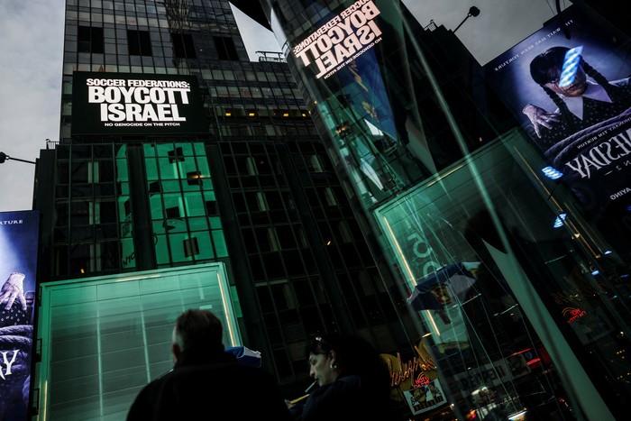 A billboard in Times Square displays the message 