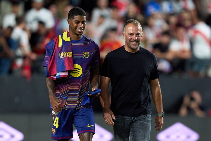 MADRID, SPAIN - AUGUST 31: Marcus Rashford of FC Barcelona interacts with Head Coach Hansi Flick prior to the LaLiga EA Sports match between Rayo Vallecano de Madrid and FC Barcelona at Estadio de Vallecas on August 31, 2025 in Madrid, Spain. (Photo by Angel Martinez/Getty Images)