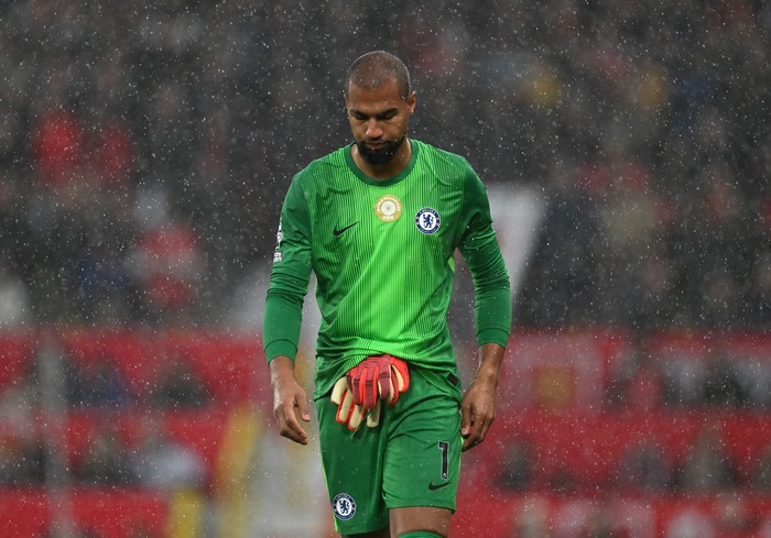 MANCHESTER, ENGLAND - SEPTEMBER 20: Robert Sanchez of Chelsea looks dejected after being shown a red card for a foul on Bryan Mbeumo of Manchester United (not pictured) during the Premier League match between Manchester United and Chelsea at Old Trafford on September 20, 2025 in Manchester, England. (Photo by Darren Walsh/Chelsea FC via Getty Images)