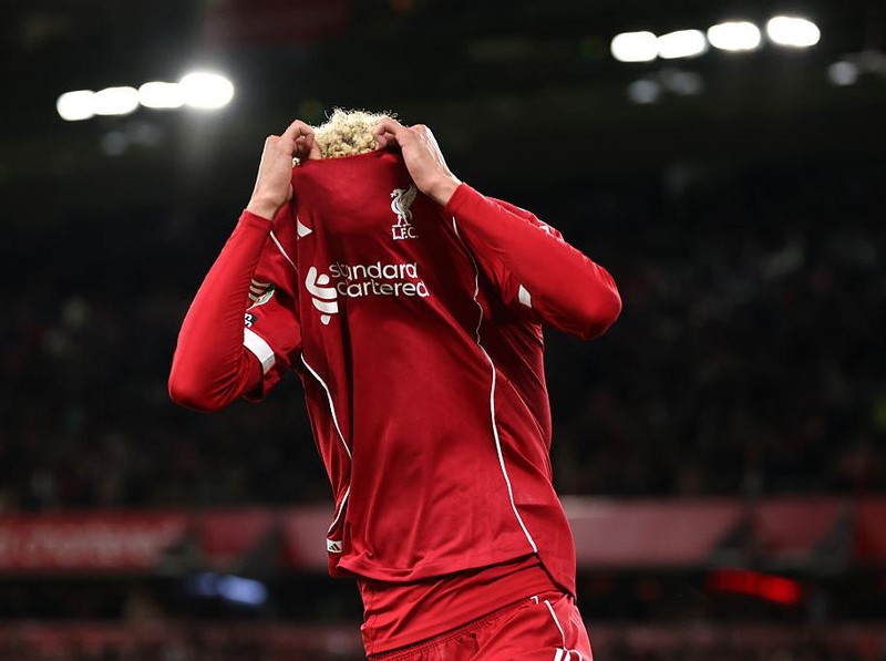 LIVERPOOL, ENGLAND - SEPTEMBER 23: (THE SUN OUT, THE SUN ON SUNDAY OUT) Hugo Ekitike of Liverpool celebrates scoring his team's second goal by removing his match shirt and subsequently receives a second yellow card from Referee Thomas Bramall (not pictured) to be sent off during the Carabao Cup Third Round match between Liverpool and Southampton at Anfield on September 23, 2025 in Liverpool, England. (Photo by Liverpool FC/Liverpool FC via Getty Images)