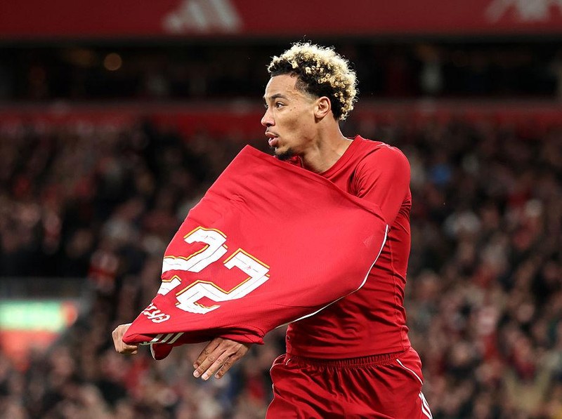 LIVERPOOL, ENGLAND - SEPTEMBER 23: Hugo Ekitike of Liverpool celebrates scoring his team's second goal by removing his match shirt and subsequently receives a second yellow card from Referee Thomas Bramall (not pictured) to be sent off during the Carabao Cup Third Round match between Liverpool and Southampton at Anfield on September 23, 2025 in Liverpool, England. (Photo by Jan Kruger/Getty Images)