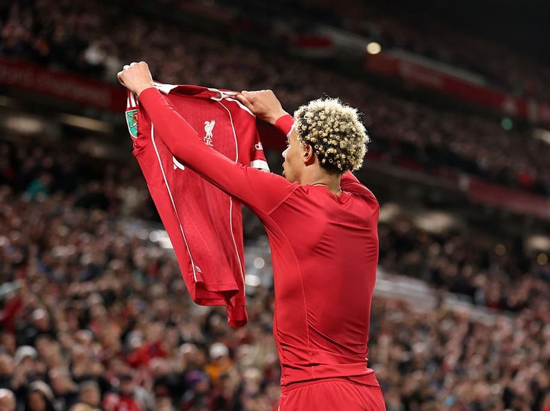 LIVERPOOL, ENGLAND - SEPTEMBER 23: Hugo Ekitike of Liverpool celebrates scoring his team's second goal by removing his match shirt and subsequently receives a second yellow card from Referee Thomas Bramall (not pictured) to be sent off during the Carabao Cup Third Round match between Liverpool and Southampton at Anfield on September 23, 2025 in Liverpool, England. (Photo by Jan Kruger/Getty Images)