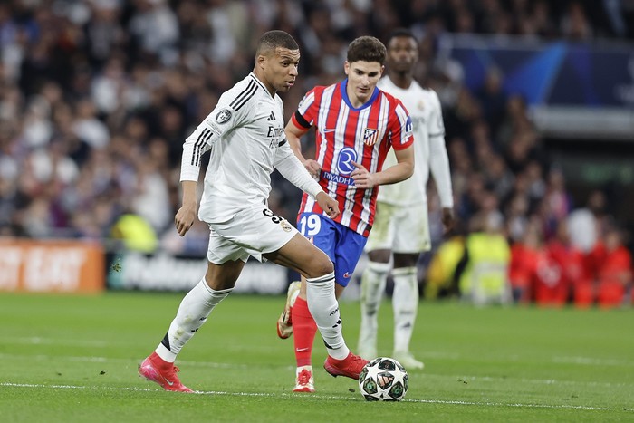 Madrid, Spain - March 4: Kyliam Mbappe of Real Madrid CF and Julian Alvarez of Atletico de Madrid battle for the ball during the UEFA Champions League 2024/25 Round of 16 First Leg match between Real Madrid C.F. and Atletico de Madrid at Estadio Santiago Bernabéu on March 4, 2025 in Madrid, Spain. (Photo by Manu Reino/DeFodi Images via Getty Images)