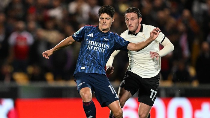 BURSLEM, ENGLAND - SEPTEMBER 24: Christian Norgaard of Arsenal is closed down by Ruari Paton of Port Vale during the Carabao Cup Third Round match between Port Vale and Arsenal at Vale Park on September 24, 2025 in Burslem, England. (Photo by David Price/Arsenal FC via Getty Images)