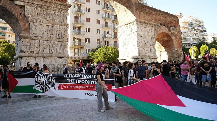 THESSALONIKI, GREECE - SEPTEMBER 24: PAOK fans, holding banners and Palestinian flags, gather under the Arch of Galerius monument to protest against the participation of Israeli teams in sporting events prior the football match between PAOK and Maccabi Tel Aviv on the 1st day of the 1st round of the League Phase of the Europa League at Toumba Stadium in Thessaloniki, Greece on September 24, 2025. (Photo by Konstantinos Tsakalidis/Anadolu via Getty Images)