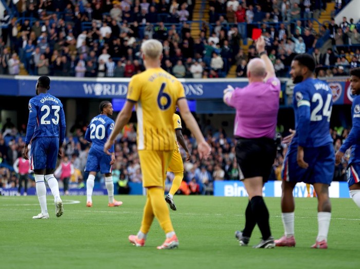 Chelsea's Trevoh Chalobah (left) is given a red card during the Premier League match at Stamford Bridge, London. Picture date: Saturday September 27, 2025. (Photo by Steven Paston/PA Images via Getty Images)