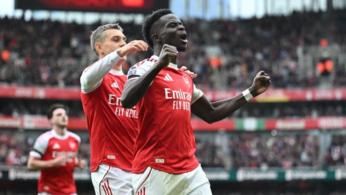 LONDON, ENGLAND - OCTOBER 04: Bukayo Saka of Arsenal celebrates scoring his teams second goal from the penalty spot during the Premier League match between Arsenal and West Ham United at Emirates Stadium on October 04, 2025 in London, England. (Photo by Stuart MacFarlane/Arsenal FC via Getty Images)