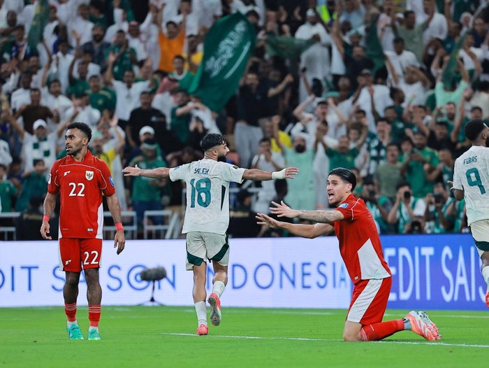 Soccer Football - FIFA World Cup - AFC Qualifiers - Group B - Indonesia v Saudi Arabia - King Abdullah Sports City, Jeddah, Saudi Arabia - October 8, 2025 Saudi Arabia's Feras Al-Brikan celebrates scoring their third goal with Saudi Arabia's Waheb Saleh REUTERS/Stringer