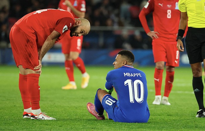 PARIS, FRANCE - OCTOBER 10: Kylian Mbappé (#10) of France speaks with Elvin Badalov of Azerbaijan after suffering an injury during the FIFA World Cup 2026 qualifier match between France and Azerbaijan at Parc des Princes on October 10, 2025 in Paris, France. (Photo by Xavier Laine/Getty Images)