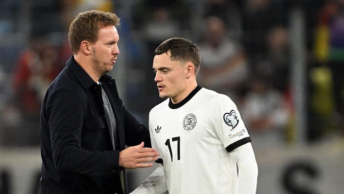 10 October 2025, Baden-Württemberg, Sinsheim: Soccer: World Cup Qualification Europe, Germany - Luxembourg, Group Phase, Group A, Matchday 3, PreZero Arena, Germany coach Julian Nagelsmann (Germany) and Florian Wirtz (Germany) after the match. Photo: Federico Gambarini/dpa (Photo by Federico Gambarini/picture alliance via Getty Images)