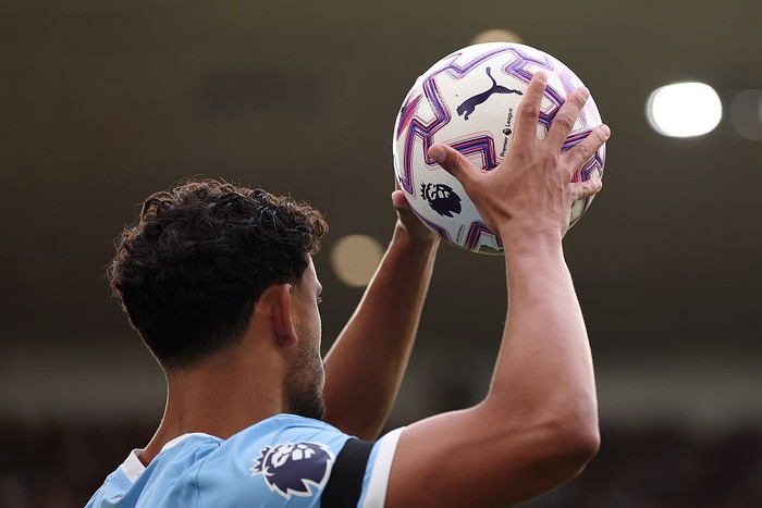 WOLVERHAMPTON, ENGLAND - AUGUST 16: Matheus Nunes of Manchester City takes a throw-in with the Puma match ball during the Premier League match between Wolverhampton Wanderers and Manchester City at Molineux on August 16, 2025 in Wolverhampton, England. (Photo by Alex Pantling/Getty Images)